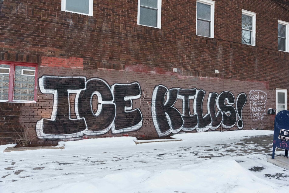 Graffiti reading "ICE kills" lines a building in Minneapolis, Minnesota, on January 19, 2026.