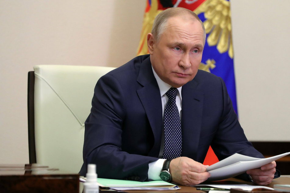 Vladimir Putin chairing a government meeting via videolink on Thursday.