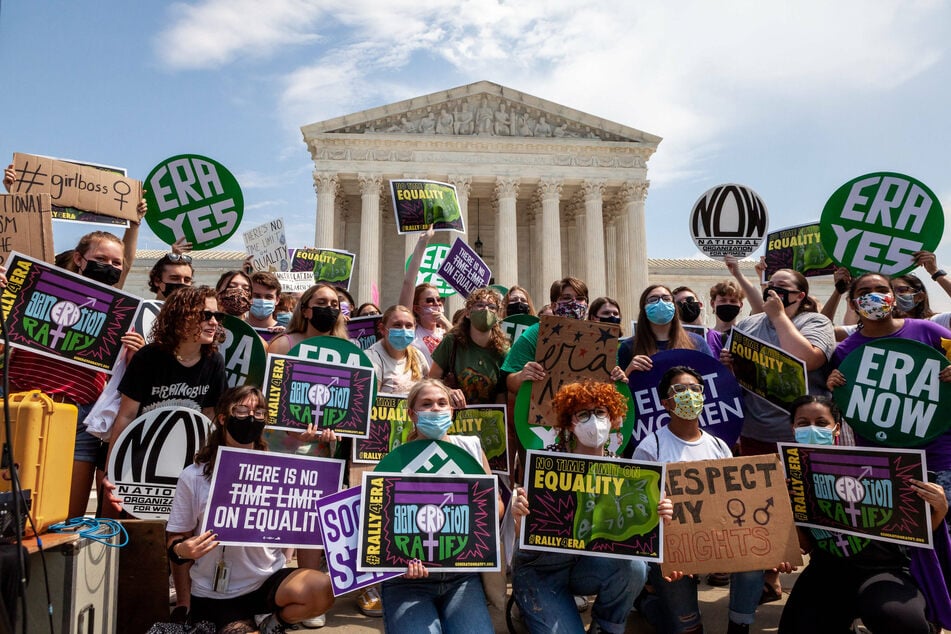 Activists rally outside the US Supreme Court demanding the certification of the Equal Rights Amendment.