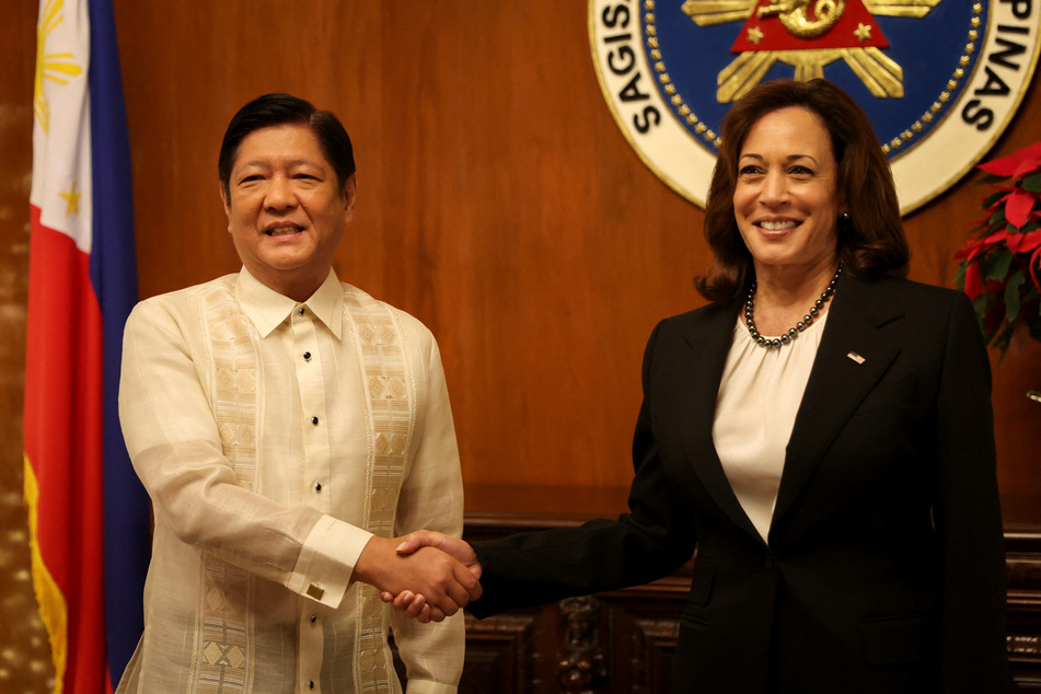 US Vice President Kamala Harris shakes hands with Philippines President Ferdinand "Bongbong" Marcos Jr. at the Malacanang presidential palace in Manila.