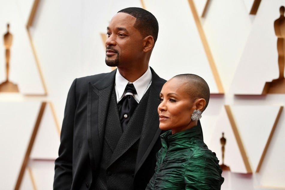 Will Smith (l.) was banned from attending the Oscars for the next 10 years after he slapped Chris Rock for joking about his wife's shaved head.