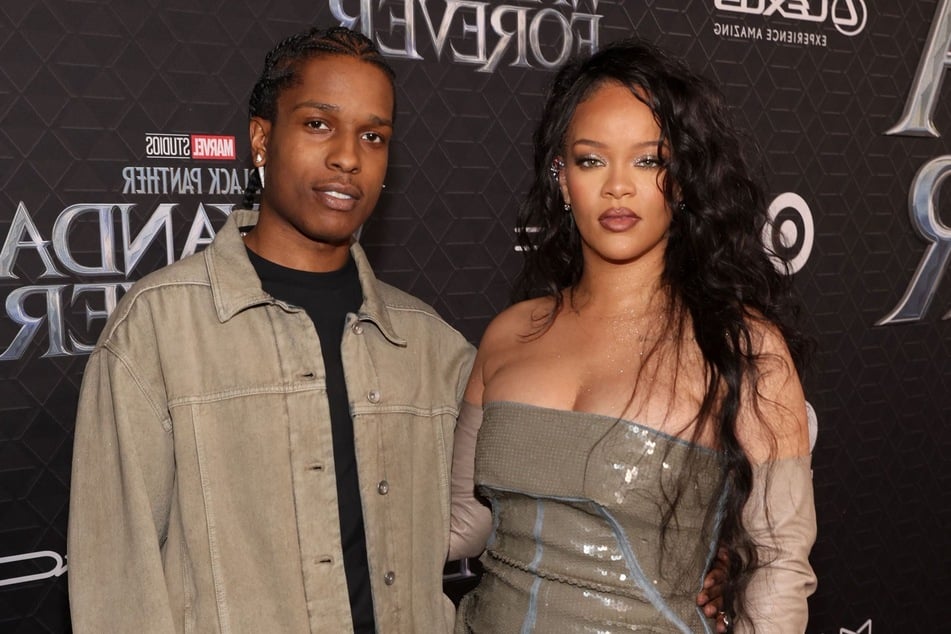 Rihanna (r) and A$AP Rocky are apparently not married just yet, but wedding bells are still in the future for them.