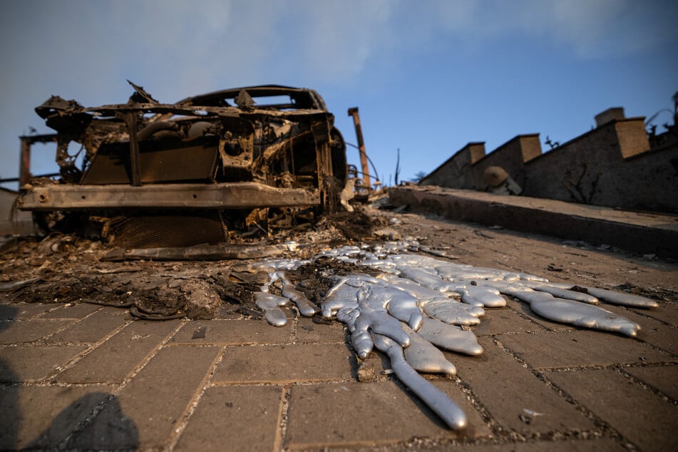 Melted metal from a vehicle destroyed by the Palisades Fire is pictured in the Pacific Palisades neighborhood in Los Angeles, California.