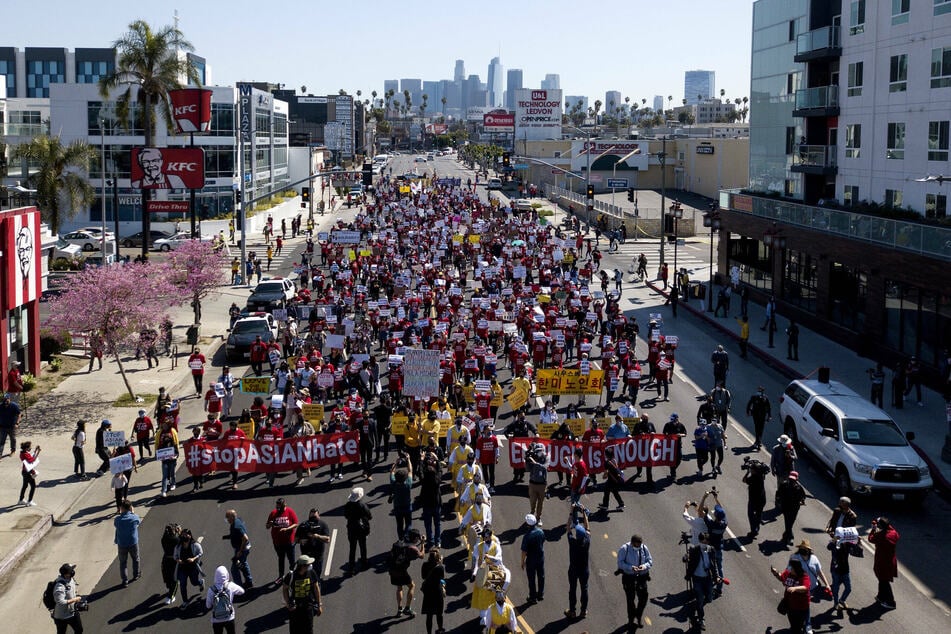 Hundreds of demonstrators gathered in Koreatown for a unity rally and march down Olympic Boulevard in Los Angeles.