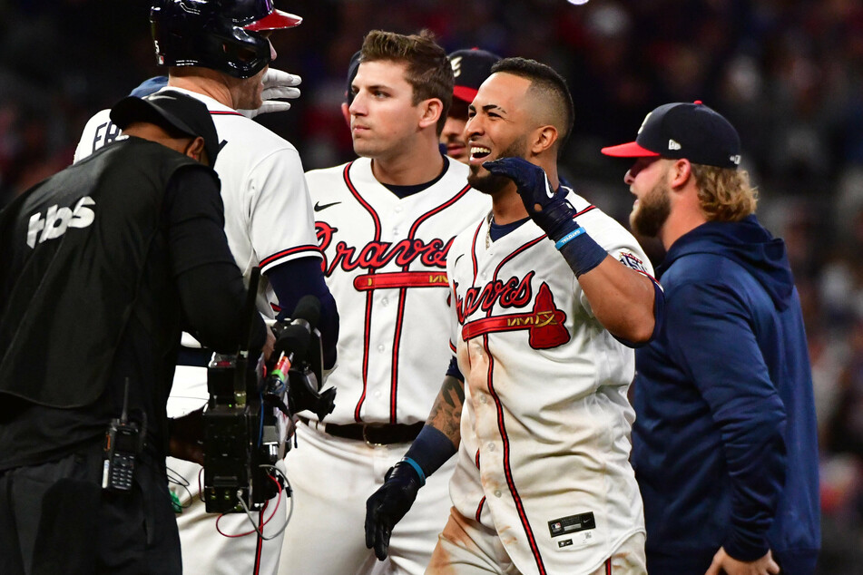 Eddie Rosario celebrates after his game-winning hit as the Braves now take a two-game NLCS lead over the Dodgers.