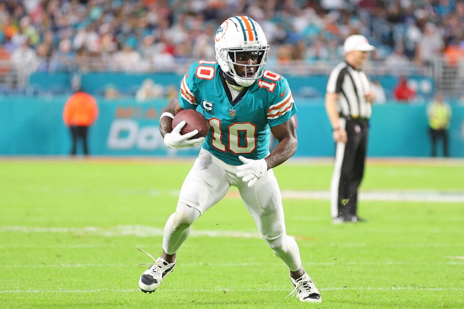 Tyreek Hill #10 of the Miami Dolphins runs for yards during a game against the Dallas Cowboys at Hard Rock Stadium on December 24, 2023 in Miami Gardens, Florida.