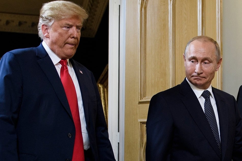 President Donald Trump (L) and Russian President Vladimir Putin (R) arrive for a meeting in Helsinki on July 16, 2018.