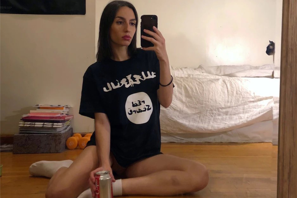The shirts print the name of the podcast, but the design, which borrows from the Islamic State flag, has sparked deep controversy.