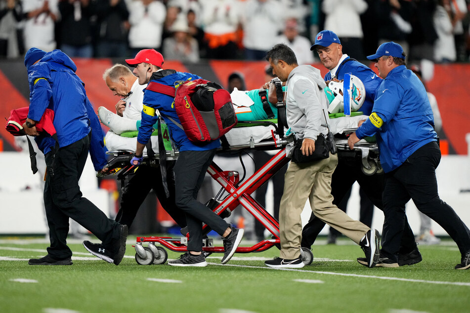 Tua Tagovailoa is taken off the field after suffering a head injury following a sack by Cincinnati Bengals defensive tackle Josh Tupou.
