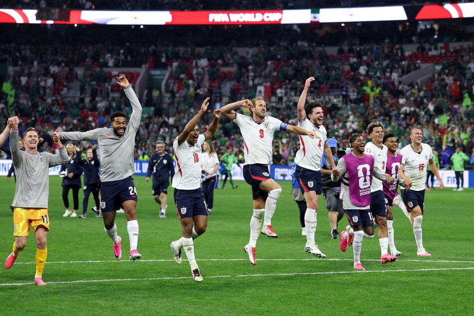 England players celebrate after winning their World Cup Round of 16 match against Mexico.