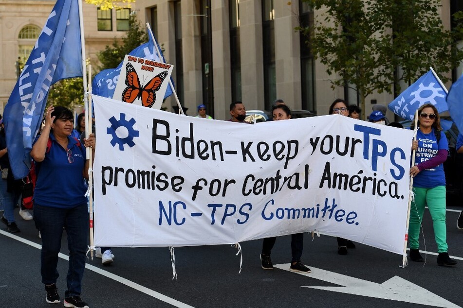 TPS holders and allies march for residency protections near the White House in Washington DC on September 23, 2022.