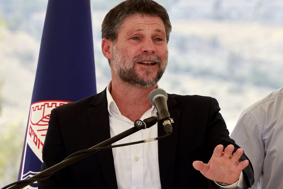 Israeli far-right Finance Minister Bezalel Smotrich speaks during a a press conference near the settlement of Maale Adumim, in a land corridor known as E1, outside Jerusalem in the occupied West Bank, on August 14, 2025.
