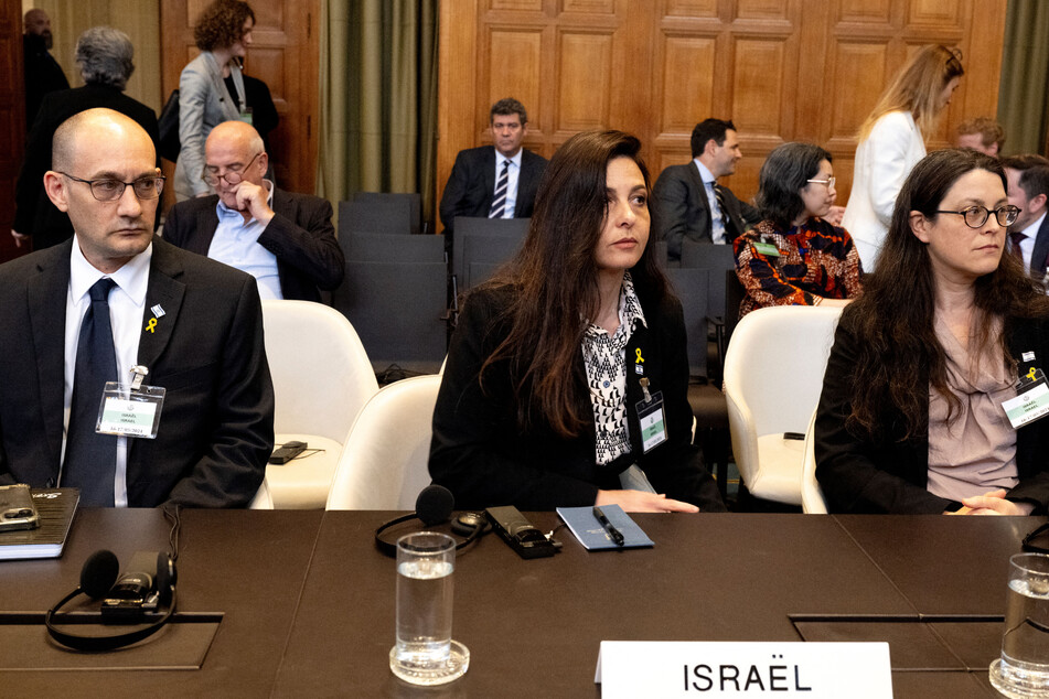 (From l. to r.) Israel's deputy Attorney General for International Law, Gilad Noam, Principal Deputy Legal Adviser of the Ministry of Foreign Affairs of Israel, Tamar Kaplan Tourgman, and Legal Adviser at the Israeli Embassy to the Netherlands, Avgail Frisch Ben Avraham, wait to hear the arguments of South Africa's legal team.