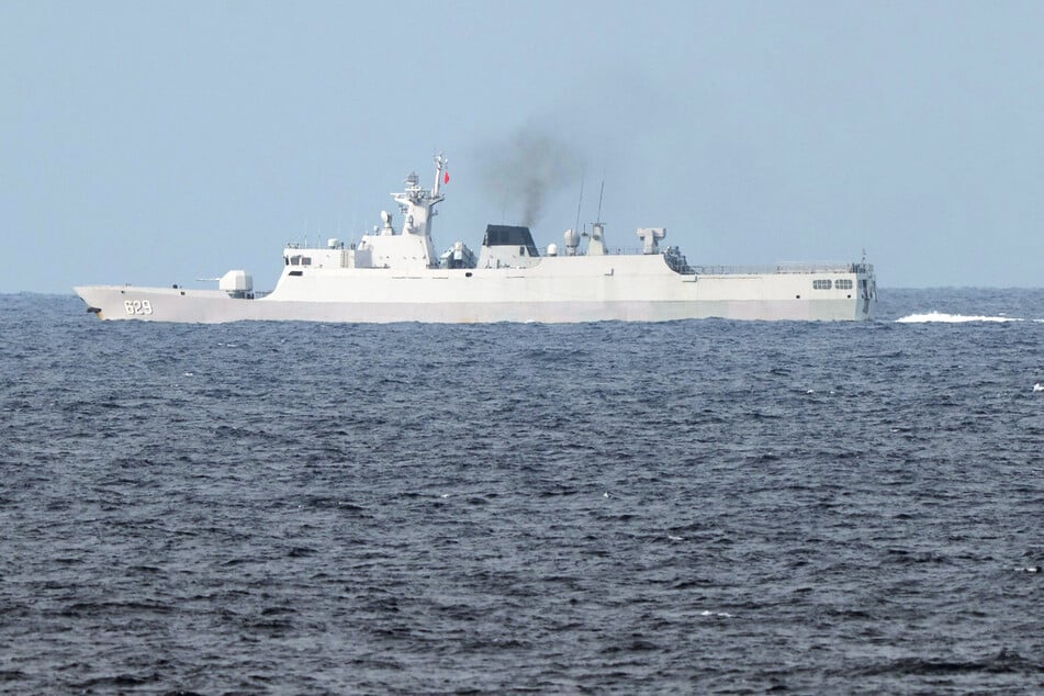 A Chinese Navy ship sails near Escoda Shoal (known as Sabina Shoal in the Philippines), as seen from the Philippine Navy ship BRP Andres Bonifacio during a maritime patrol in the disputed South China Sea, on June 7, 2025.