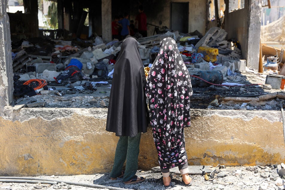 Girls check the destruction at Mustafa Hafez school after it was hit during an overnight Israeli strike in Gaza City on July 3, 2025.