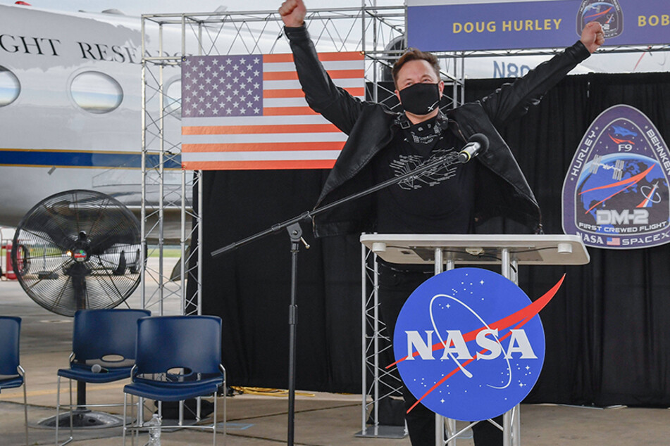 Elon Musk celebrates the return of NASA astronauts Robert Behnken and Douglas Hurley on August 2, 2020, in Houston, Texas.