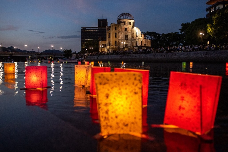 Paper lanterns float on the Motoyasu River beside the Hiroshima Prefectural Industrial Promotion Hall, commonly known as the atomic bomb dome, to mark the anniversary of the world's first atomic bomb attack.