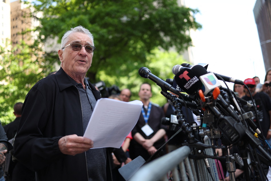 Speaking on behalf of the Biden campaign outside court, actor Robert De Niro (pictured) berated Trump as a "clown" intent on destroying the country.