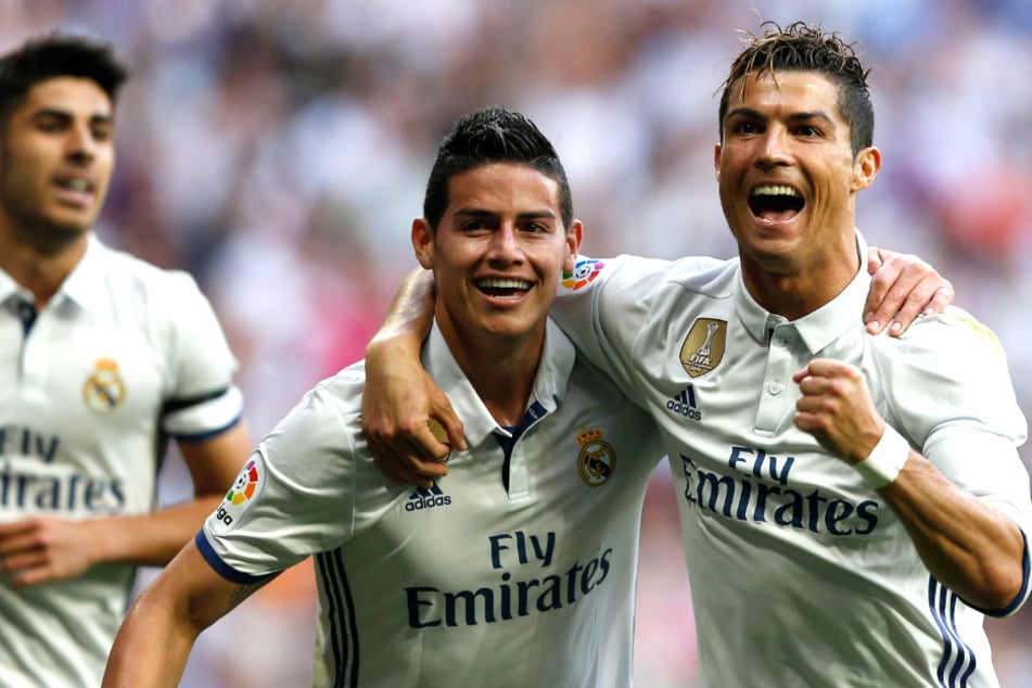 James Rodriguez (30, M.) und Cristiano Ronaldo (37, r.) spielten zwischen 2014 und 2017 zusammen bei Real Madrid. (Archivfoto)