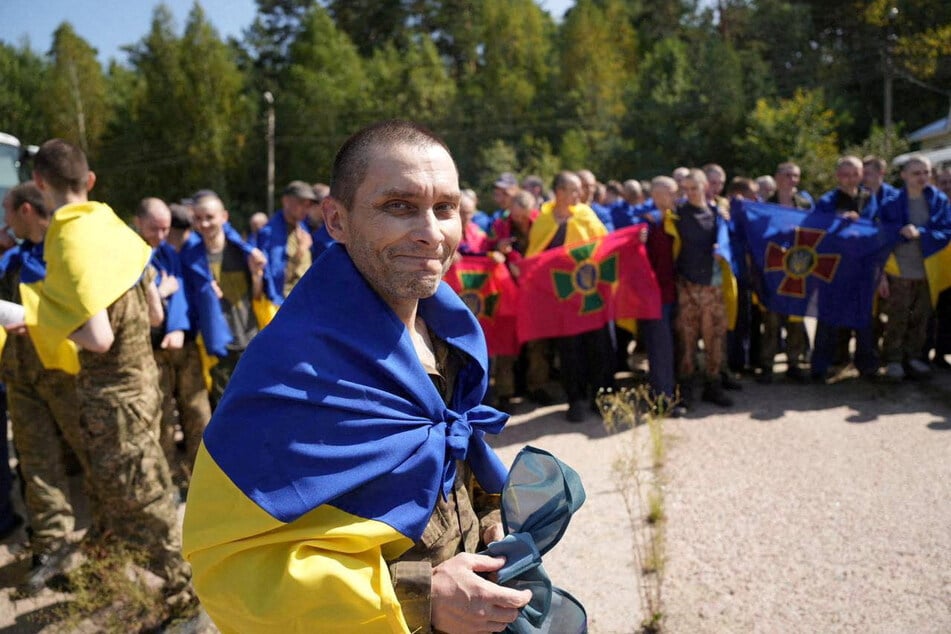 A Ukrainian prisoner of war reacts after a swap with Russia, at an unknown location in Ukraine.