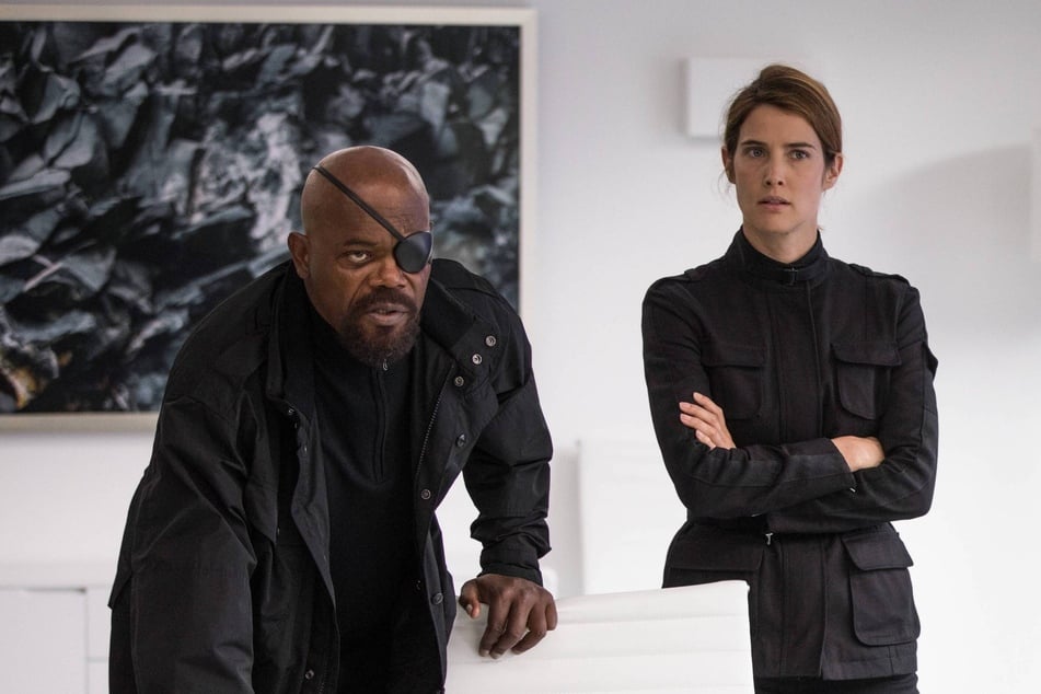 Samuel L. Jackson (l) and Colbie Smulders reprise their respective Marvel roles, as agents Nick Fury and Maria Hill, in the TV crossover series, Secret Invasion.