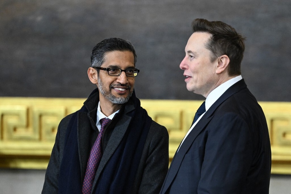 Google CEO Sundar Pichai (l.) speaks with Tesla and SpaceX CEO Elon Musk at the Donald Trump's inauguration in the US Capitol Rotunda on January 20, 2025.