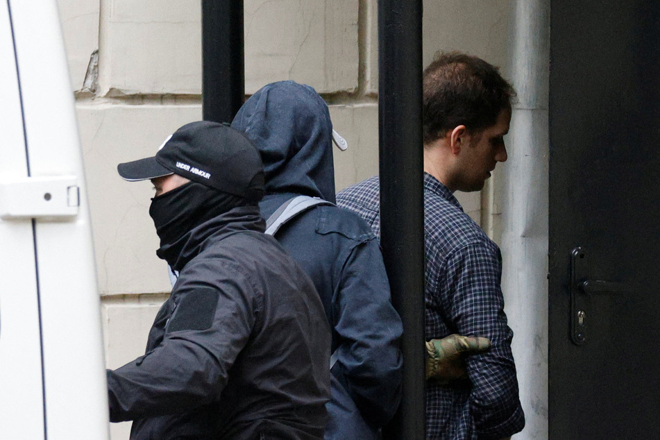 Wall Street Journal reporter Evan Gershkovich being led into a Moscow courthouse, where his detention was extended for another three months.