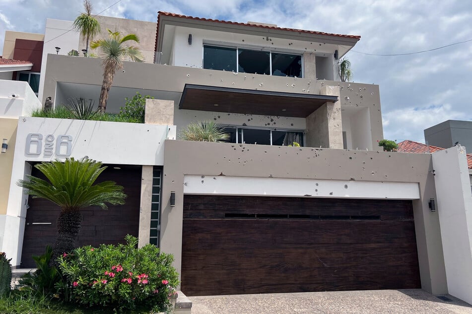 The facade of a residence with gunshot wounds is pictured at the Colinas de San Miguel subdivision in Culiacan, Sinaloa state, Mexico on July 13, 2025.