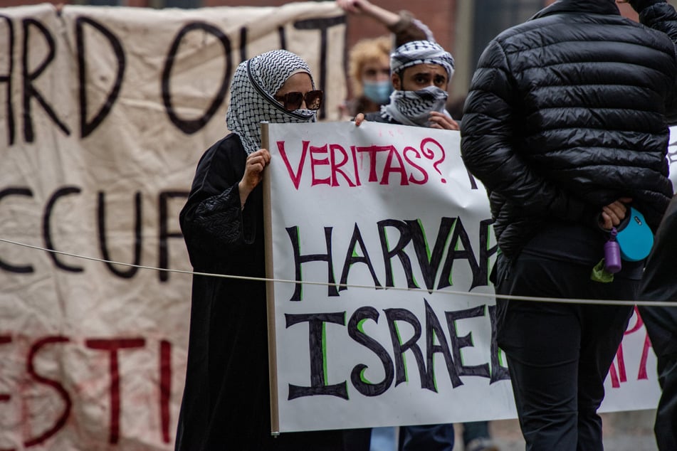 Protesters call on Harvard University to divest from Israel during a rally in Cambridge, Massachusetts, on October 14, 2023.