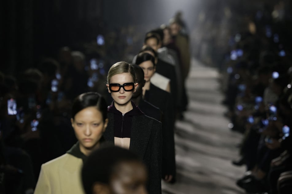 Models receive applause at the end of a presentation by Victoria Beckham for the Womenswear Ready-to-wear Fall-Winter 2025/2026 collection as part of Paris Fashion Week on March 7, 2025.