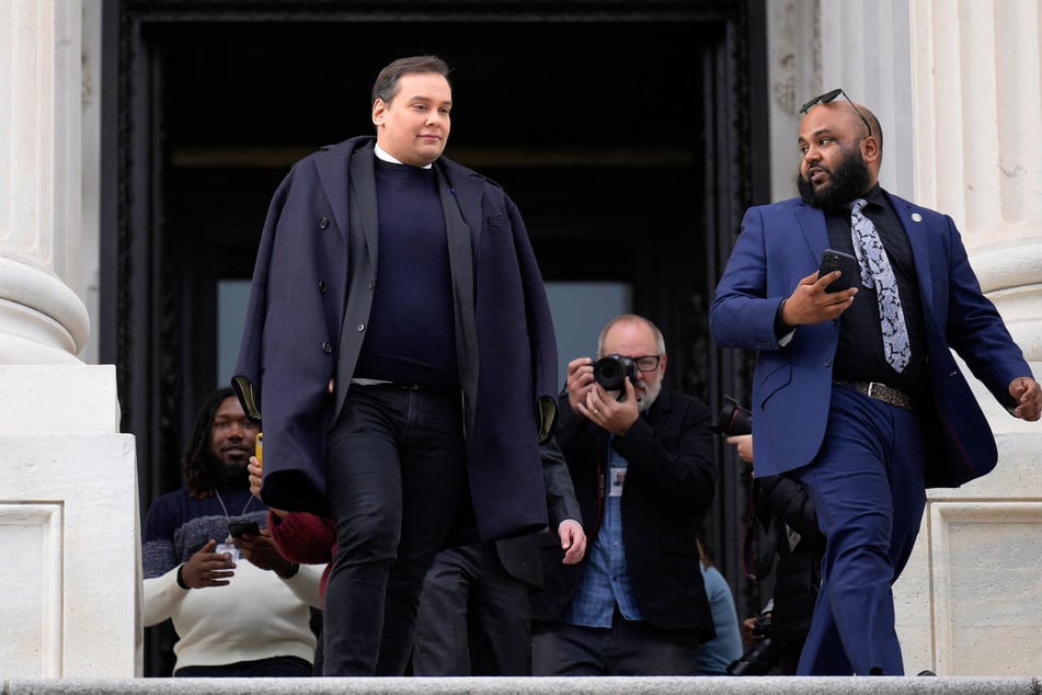 George Santos (l.) and Vish Burra leaving the US Capitol after Congress voted to expel Santos from the House of Representatives on December 01, 2023, in Washington, DC.