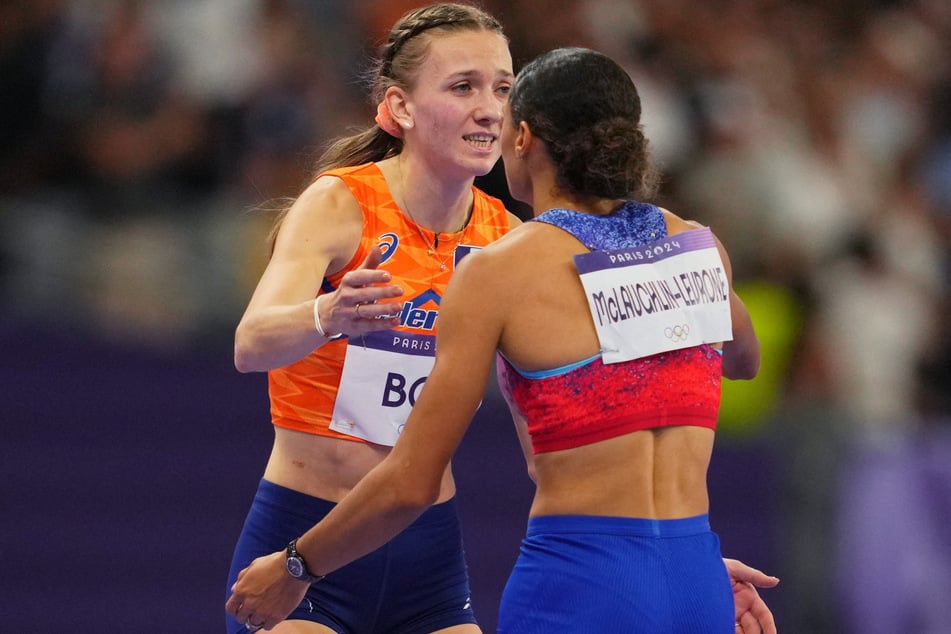 Gold medalist Sydney McLaughlin-Levrone of Team USA (r.) congratulations bronze medalist Femke Bol of Netherlands after the 400m hurdles final at the Paris Olympics.