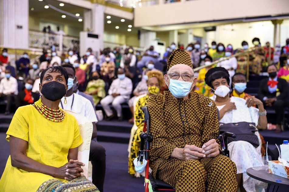 Hughes Van Ellis sits among family members during a service at Action Chapel International church in Accra, Ghana, on August 15, 2021.