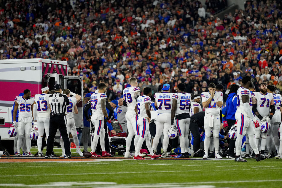 Bills players and staff were seen praying together on the field as an ambulance took Hamlin to hospital.