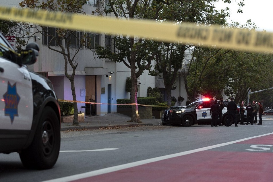 Police officers are seen outside the visa office of the Chinese consulate in San Francisco, California, where earlier a vehicle crashed into the building, on October 9, 2023.