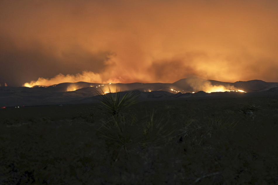 California wildfire still out of control as blaze spreads to Nevada