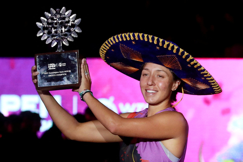 Jessica Pegula of the US celebrates with her trophy after winning her final match against Greece's Maria Sakkari at the 2022 Guadalajara Open.