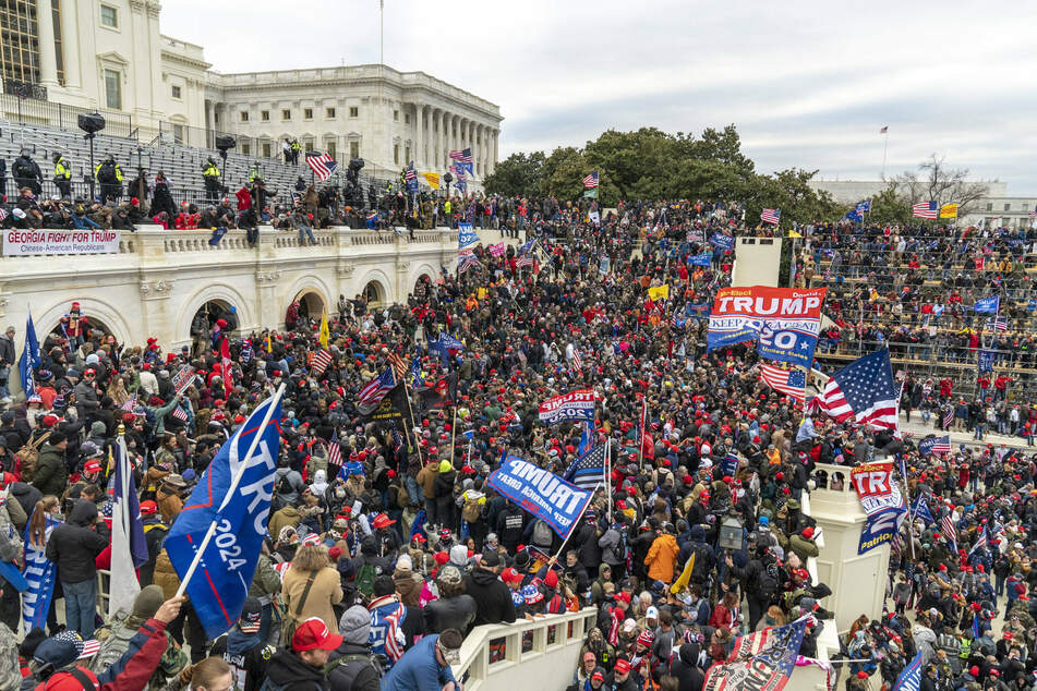 Pro-Trump rioters breach the security perimeter and penetrate the US Capitol on January 6.
