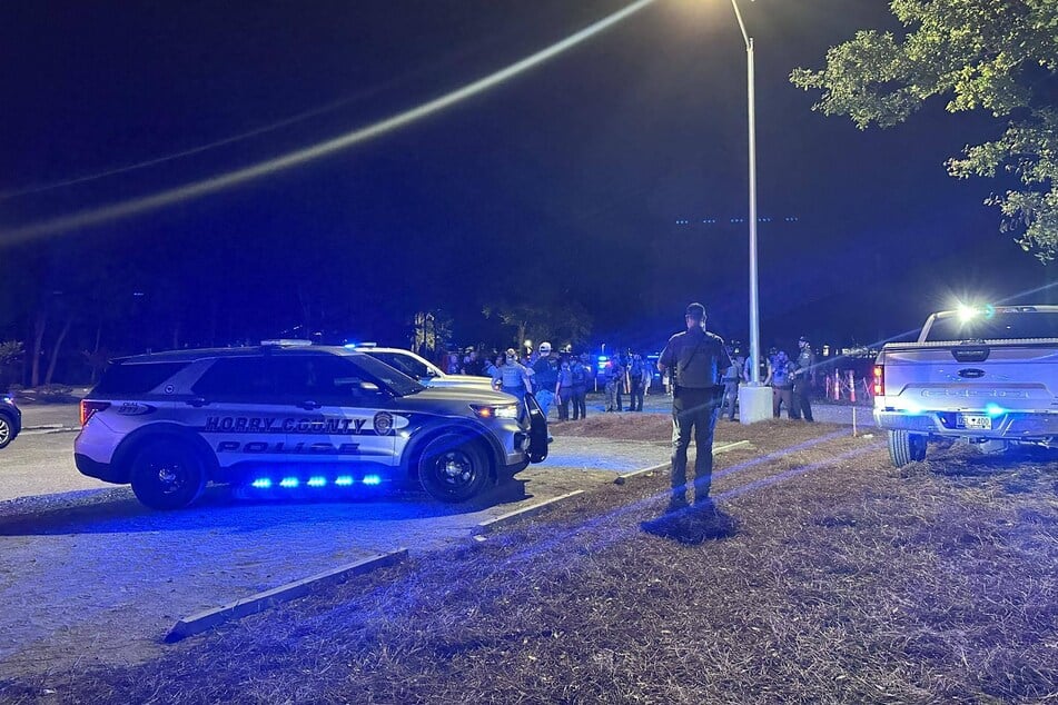 Police officers respond to the scene of a shooting in Little River, South Carolina, on May 25, 2025.