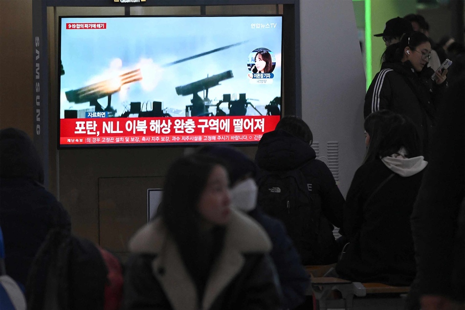 A TV in South Korea showed file footage of North Korea's artillery firing.