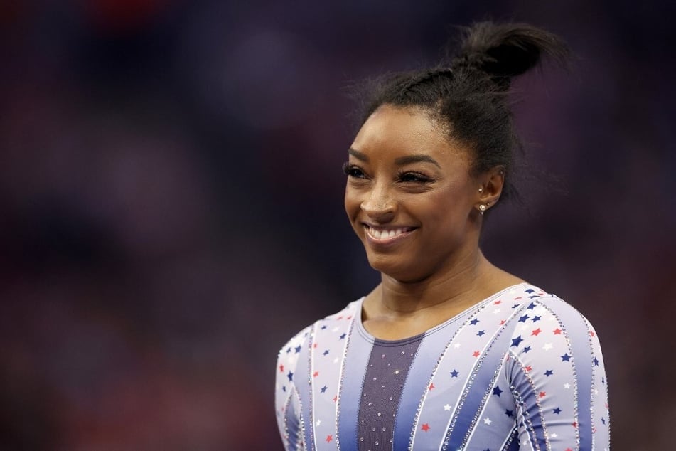 Simone Biles topped all-around standings on day one of the 2024 US gymnastics trials for the Paris Olympics.