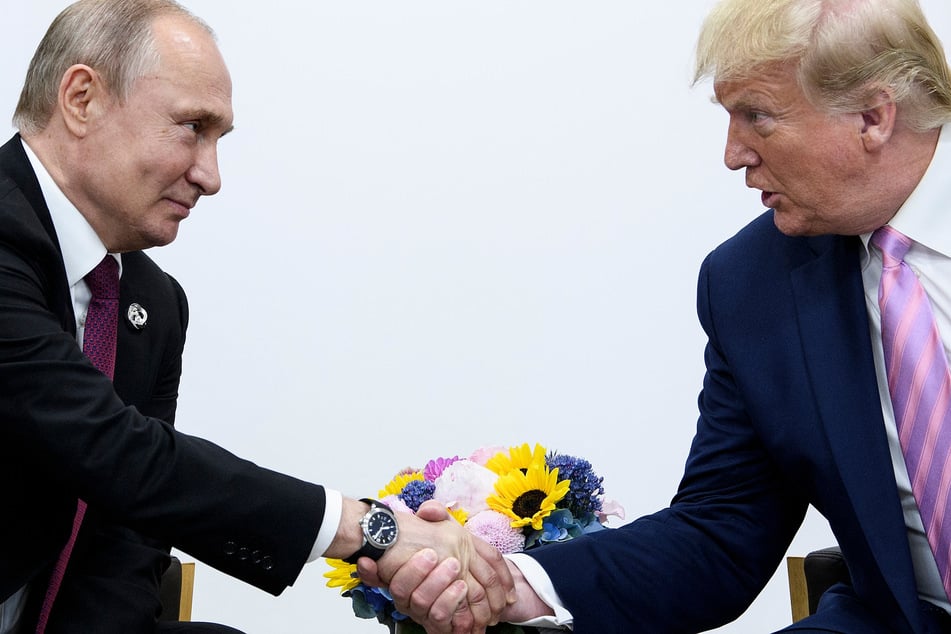 Vladimir Putin defends Donald Trump and blasts "rotten" US system