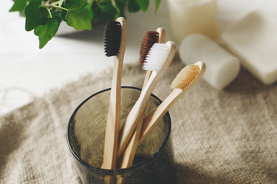 Snagging a bamboo toothbrush is one way to stop plastic waste.