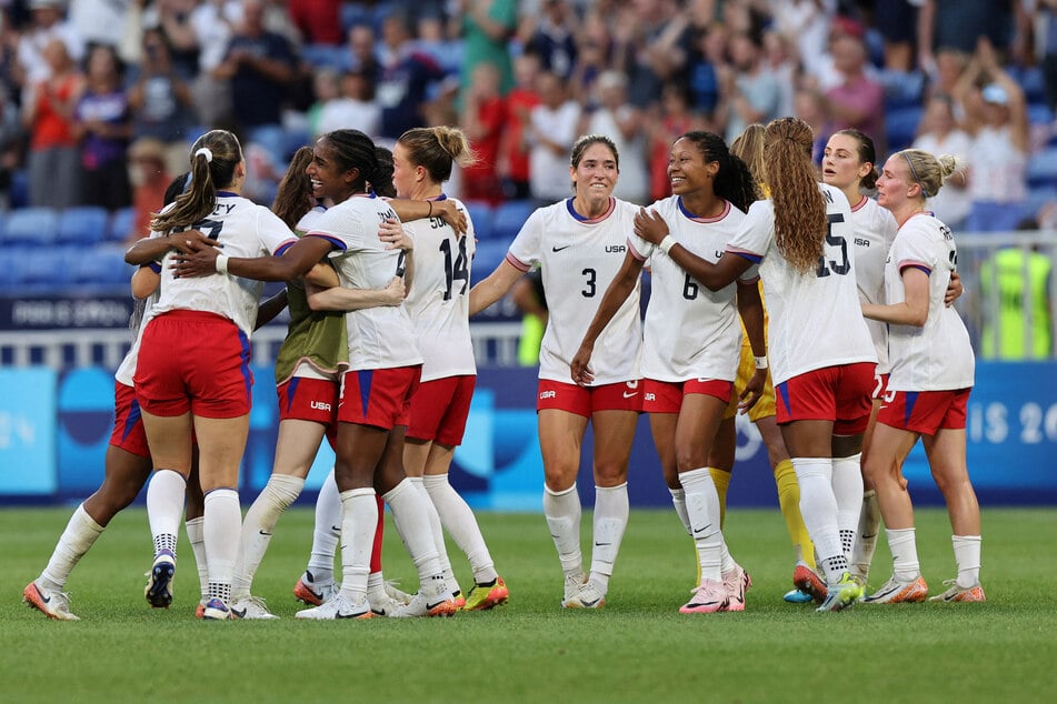 Team USA players celebrate after defeating Germany in the women's soccer semi-final at the Paris Olympics.