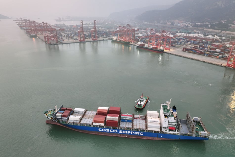 This aerial picture shows a container ship at a port in Lianyungang, China's eastern Jiangsu province. The US began charging higher tariffs on goods from dozens of trading partners on Thursday, in a major escalation of Trump's drive to reshape global commerce in America's favor.