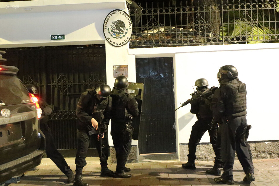 Ecuadorian police special forces are shown attempting to break into the Mexican embassy in Quito to arrest Ecuador's former Vice President Jorge Glas, on Friday.
