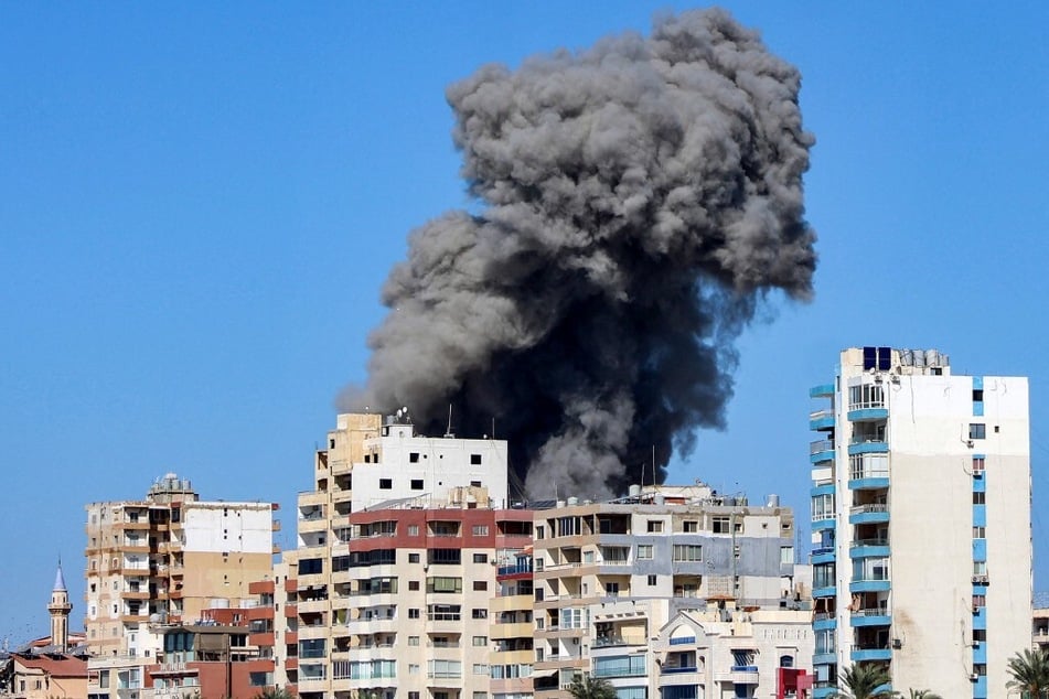 A large smoke plume rises following an Israeli air strike on a neighborhood of Lebanon's southern city of Tyre on October 23, 2024.