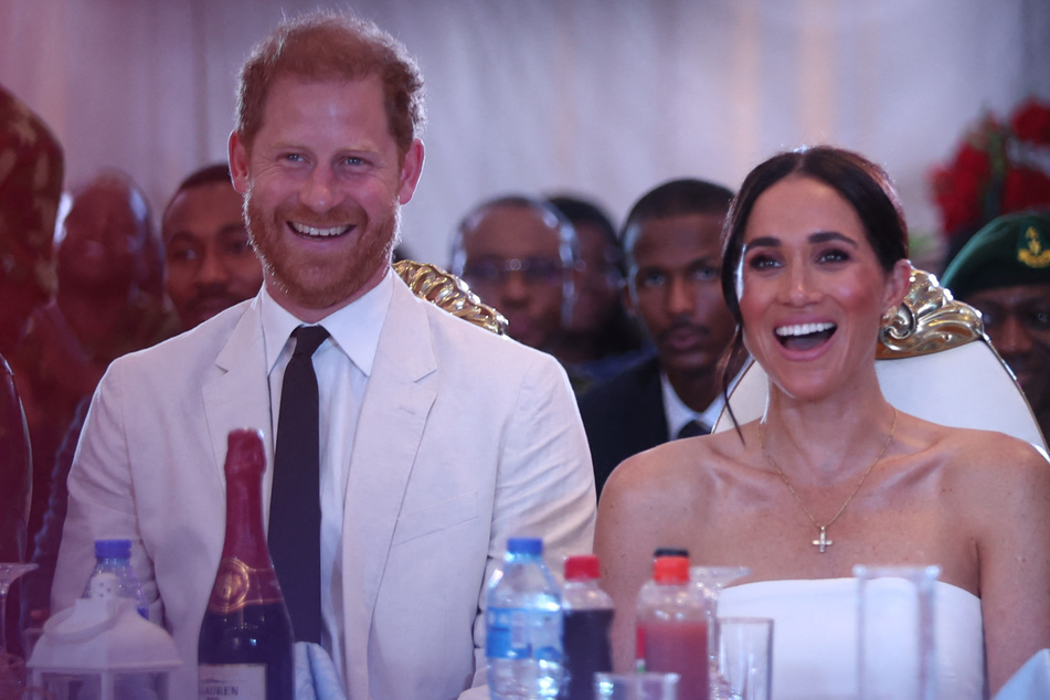 Prince Harry (l.) and Meghan Markle continued their work in Nigeria on Saturday as they promoted the Invictus Games.