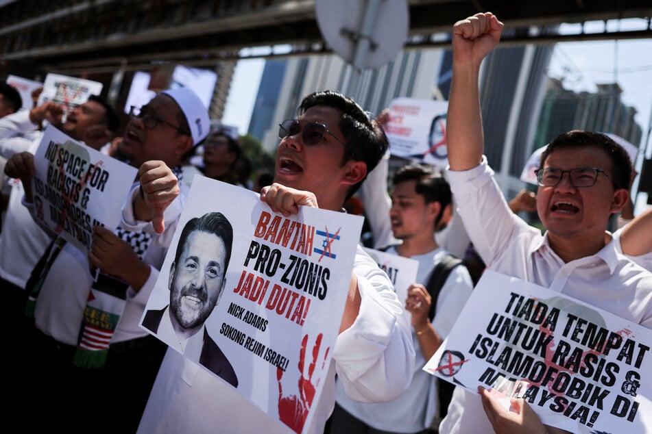 Protesters rally outside the US Embassy in Kuala Lumpur against President Donald Trump's nomination of Nick Adams as ambassador to Malaysia on July 18, 2025.