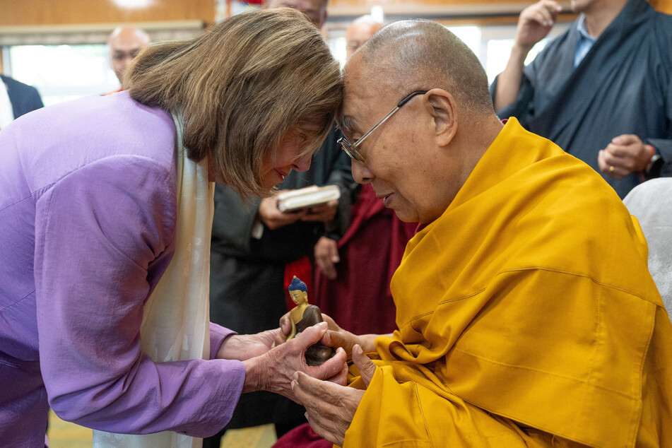 Tibetan spiritual leader, the Dalai Lama exchanges greetings with former US House Speaker Nancy Pelosi during their meeting at Dharamshala.